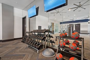 24-Hr fitness club with cardio equipment & free weights